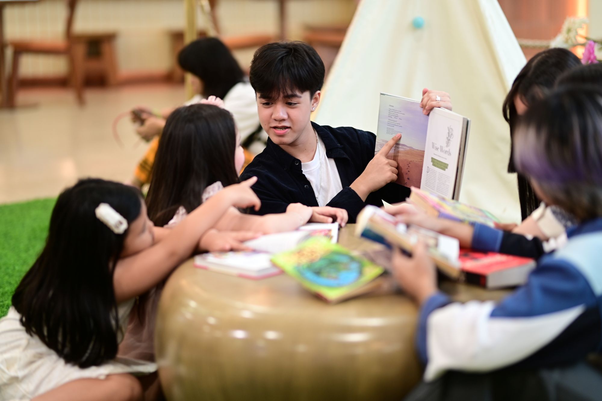 Boy reading at SM Book Nook